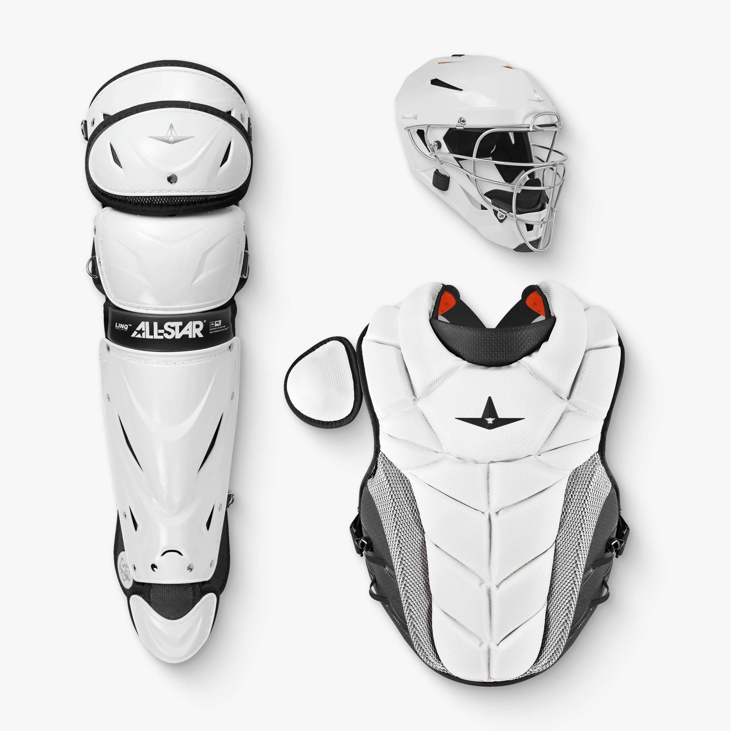Set of white catcher's gear including leg guard, chest protector, and helmet on a white background